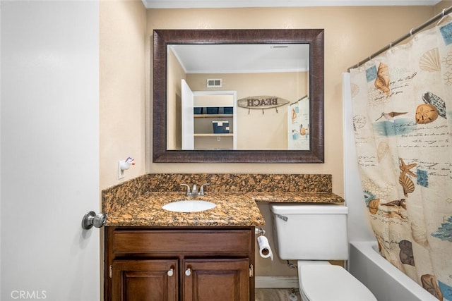 full bathroom featuring toilet, vanity, and shower / bath combo