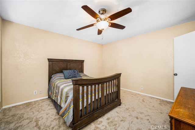 bedroom with ceiling fan and light colored carpet