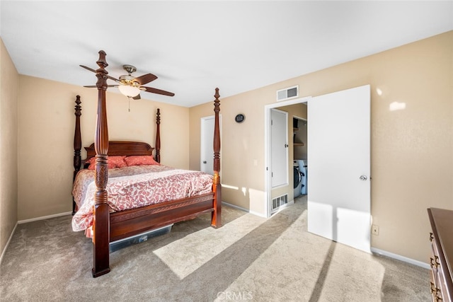 carpeted bedroom with ceiling fan and washing machine and clothes dryer