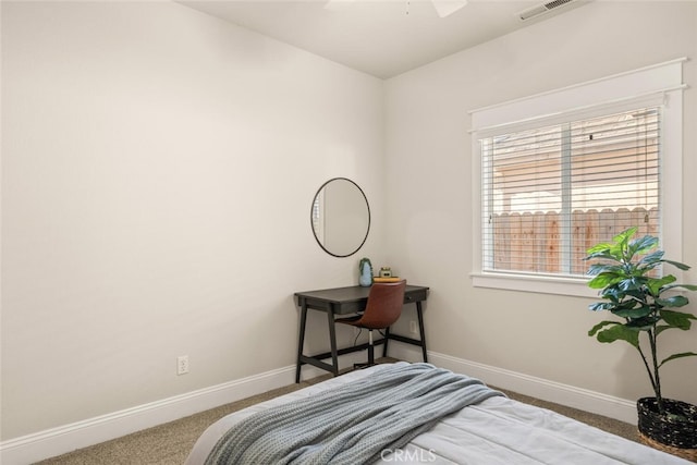 bedroom with ceiling fan and carpet floors