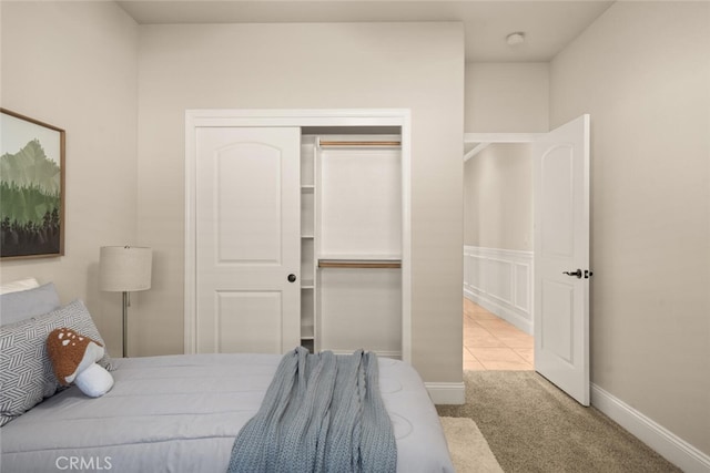 carpeted bedroom featuring a closet