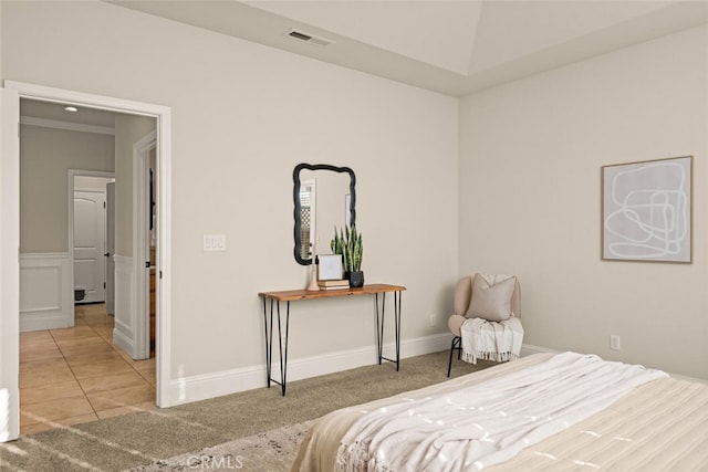 bedroom with light tile patterned floors