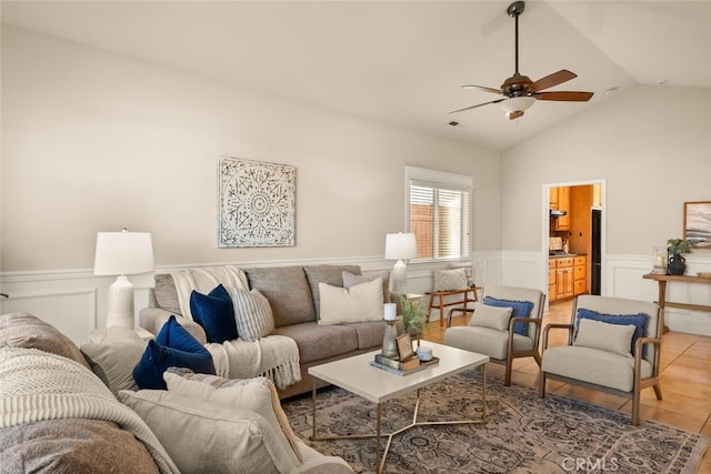 tiled living room featuring vaulted ceiling and ceiling fan