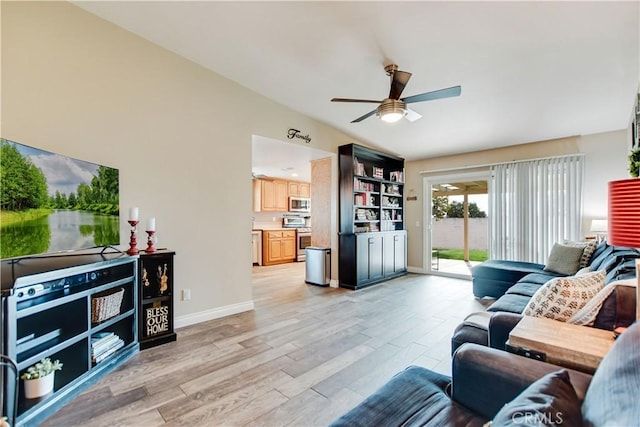 living room with ceiling fan, light hardwood / wood-style flooring, and lofted ceiling