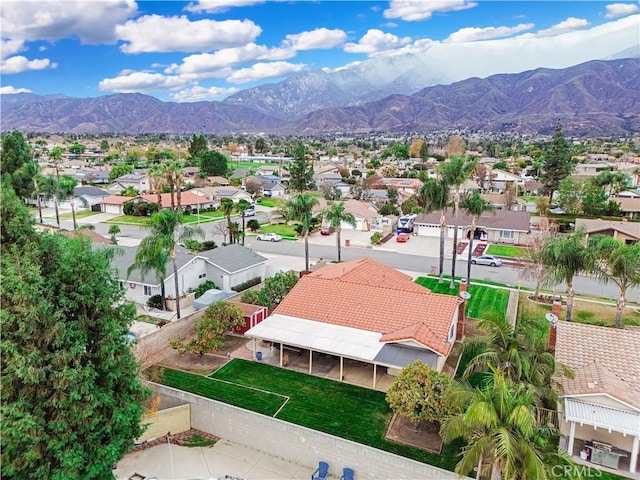 birds eye view of property featuring a mountain view