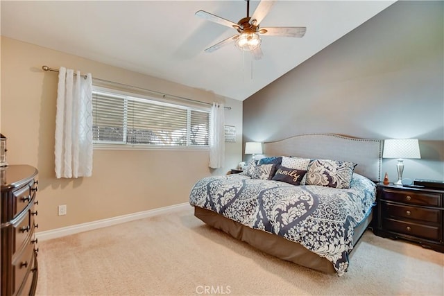 carpeted bedroom with vaulted ceiling and ceiling fan