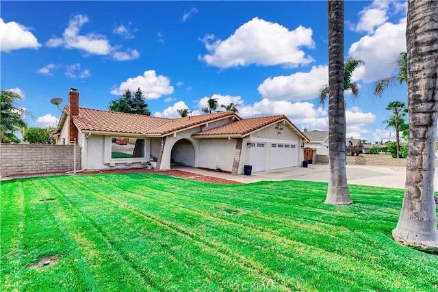 view of front facade with a front yard and a garage