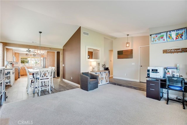 interior space with vaulted ceiling and ceiling fan