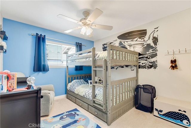 bedroom featuring light carpet and ceiling fan