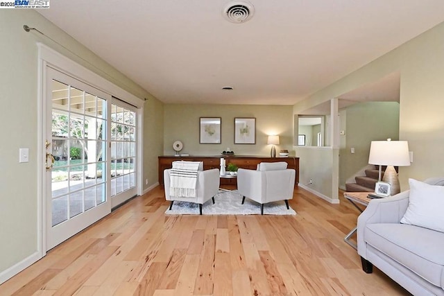 living room with light hardwood / wood-style flooring