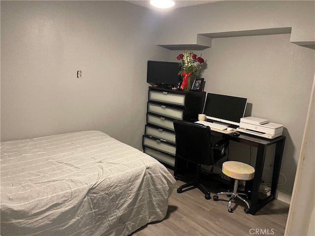 bedroom featuring hardwood / wood-style flooring