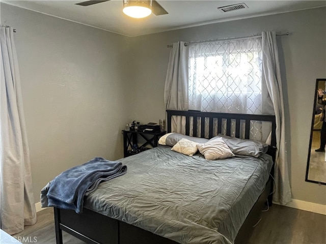 bedroom featuring ceiling fan and wood-type flooring