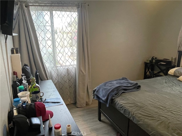 bedroom featuring wood-type flooring