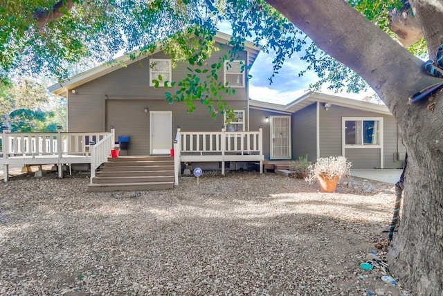 view of front of property featuring a wooden deck