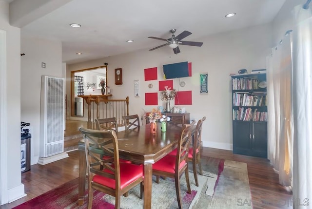 dining room featuring ceiling fan and dark hardwood / wood-style floors