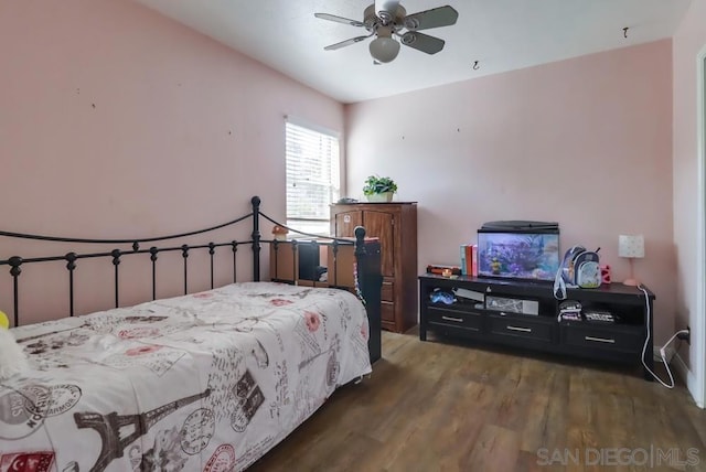 bedroom featuring ceiling fan and dark hardwood / wood-style floors