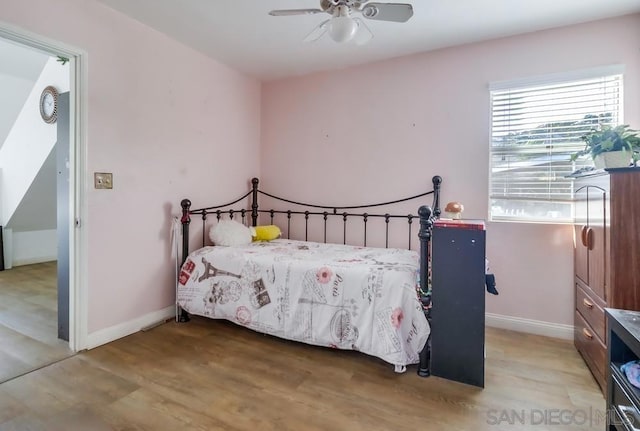 bedroom featuring light wood-type flooring and ceiling fan