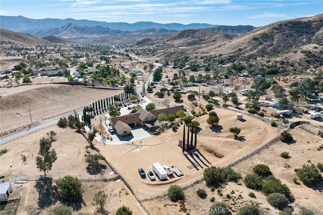 birds eye view of property featuring a mountain view