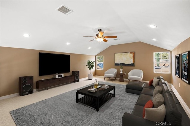 carpeted living area featuring visible vents, plenty of natural light, a ceiling fan, and vaulted ceiling