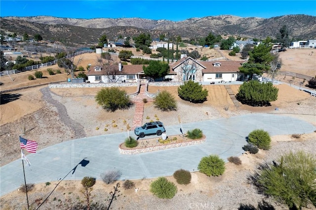 birds eye view of property featuring a mountain view