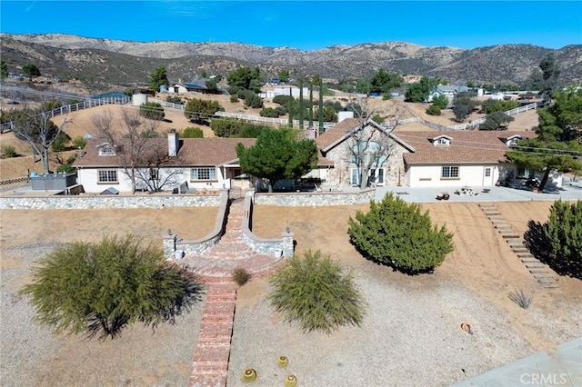 drone / aerial view featuring a mountain view