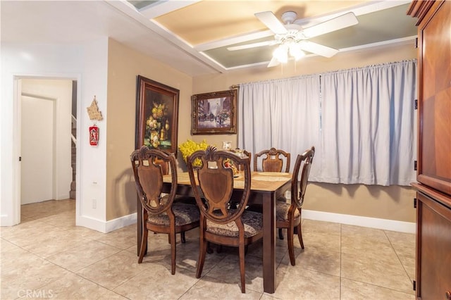 dining space with ceiling fan and light tile patterned floors