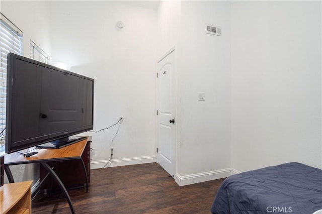 bedroom featuring dark hardwood / wood-style floors