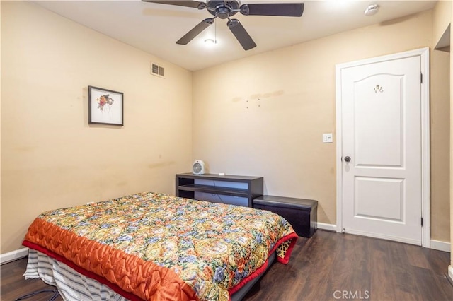 bedroom featuring ceiling fan and dark hardwood / wood-style flooring