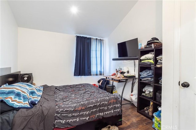 bedroom featuring lofted ceiling