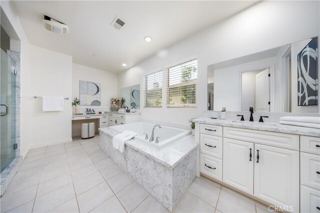 bathroom with shower with separate bathtub, tile patterned floors, and vanity