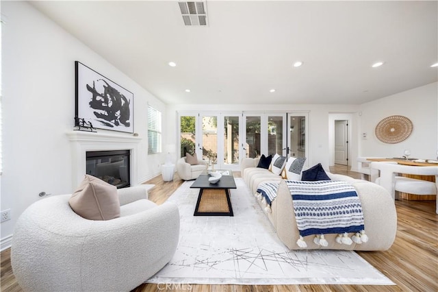 living room with light hardwood / wood-style flooring