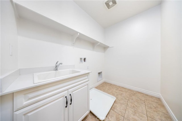 laundry room with sink, hookup for a washing machine, light tile patterned floors, electric dryer hookup, and cabinets