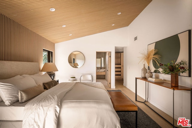 bedroom featuring ensuite bathroom, wood ceiling, and high vaulted ceiling