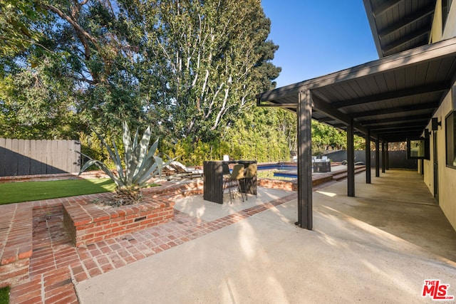 view of patio with a bar