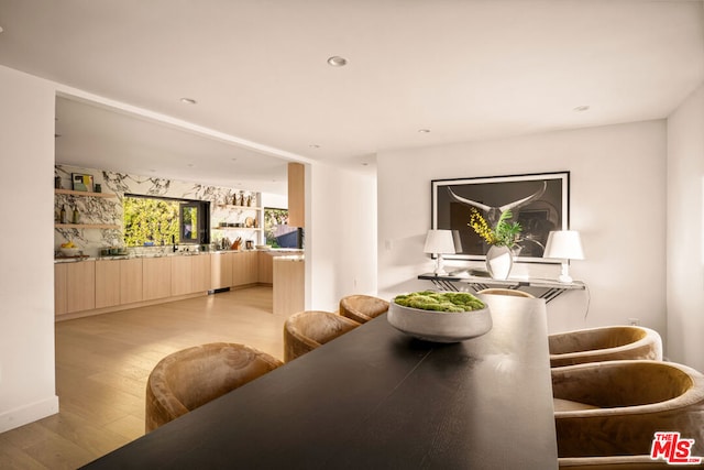 dining area with light hardwood / wood-style floors