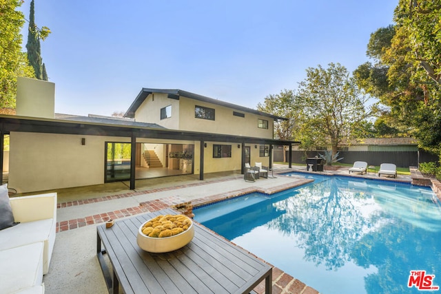 view of pool featuring a patio area