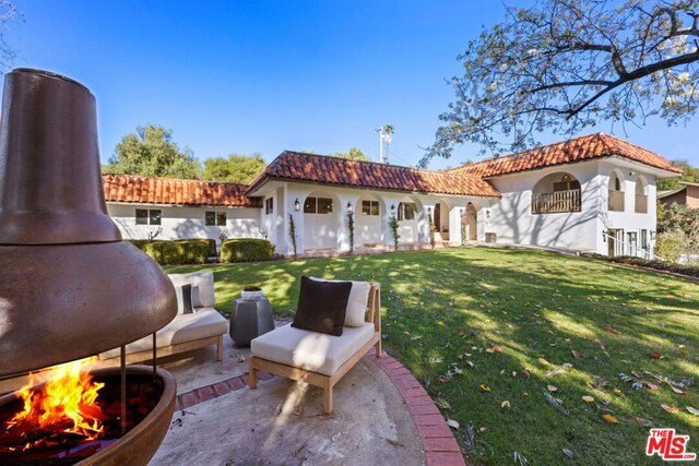 view of yard featuring an outdoor structure and a patio