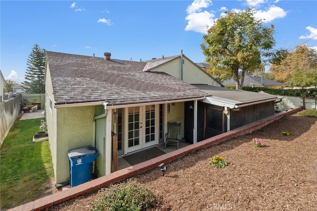 back of house featuring french doors