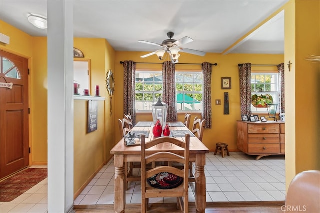 tiled dining room with ceiling fan