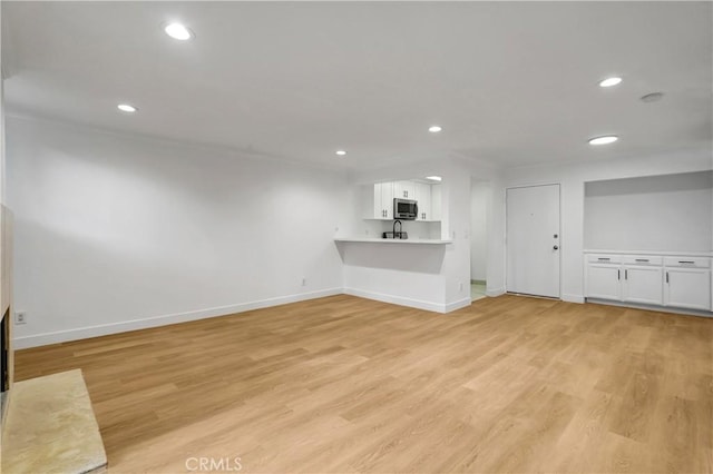 unfurnished living room featuring light hardwood / wood-style flooring