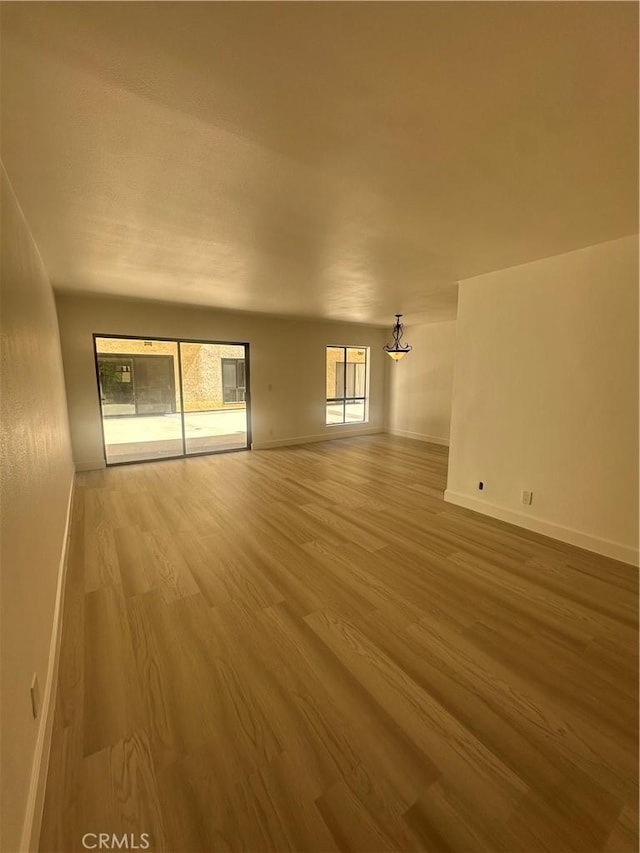 unfurnished living room featuring hardwood / wood-style floors