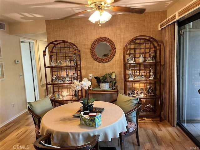 dining room featuring ceiling fan and hardwood / wood-style floors