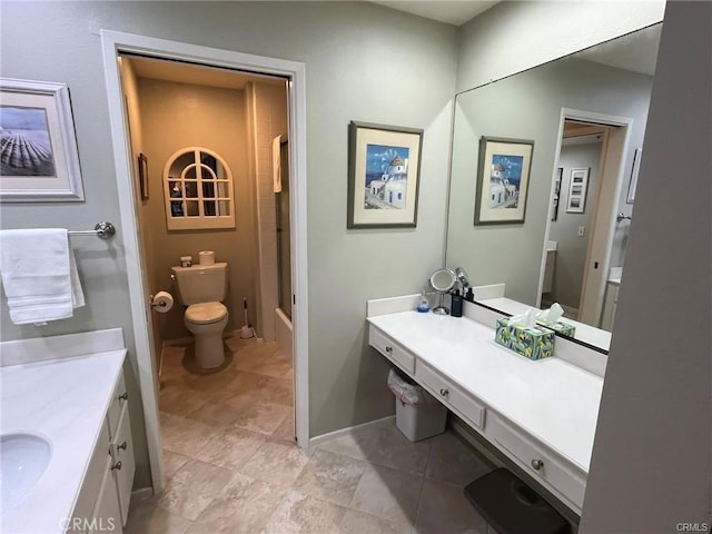 bathroom featuring toilet and vanity