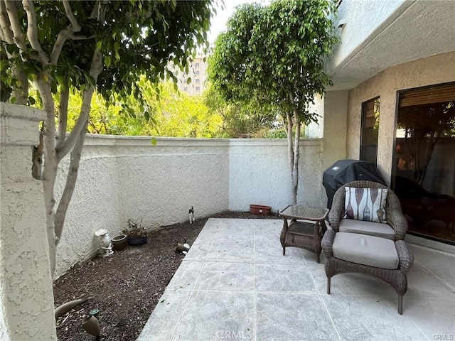 view of patio featuring a grill