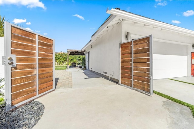 view of side of property featuring a patio