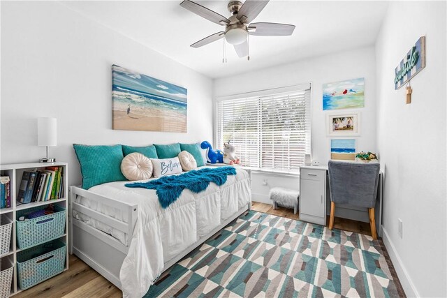 bedroom featuring ceiling fan and light wood-type flooring