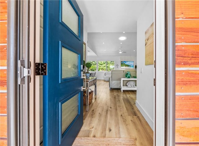 interior space featuring ceiling fan and light wood-type flooring