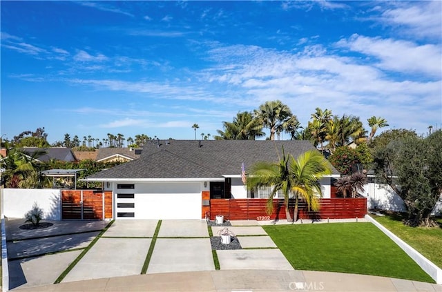 view of front facade with a garage and a front yard