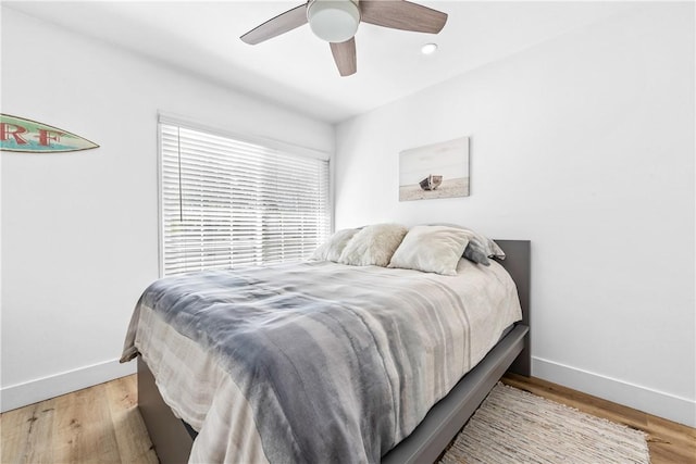 bedroom with light wood-type flooring and ceiling fan