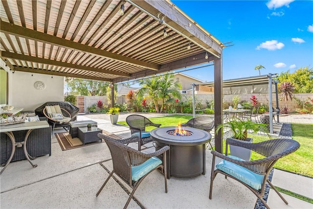 view of patio / terrace featuring a pergola and an outdoor living space with a fire pit